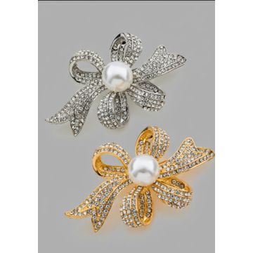  Καρφίτσα σε σχήμα φιόγκου, διακοσμημένη με στρας και μια πέρλα στο κέντρο