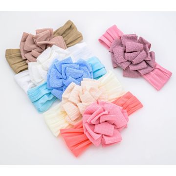 Κορδέλα μαλλιών με λουλούδι  και φιόγκο σε παστέλ